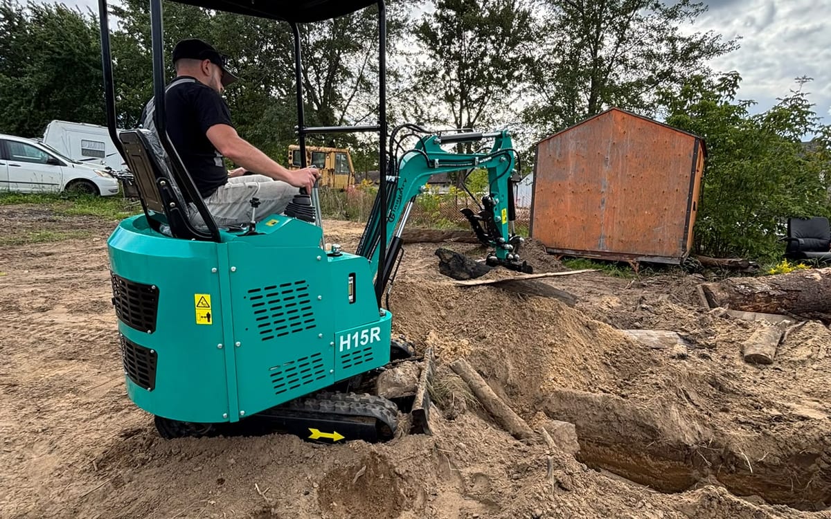Highview operator digging with a mini excavator on a residential site